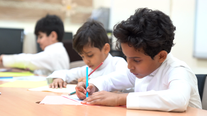 clip-1415-saudi-elementary-students-write-with-colored-pencils-during--thumbnail